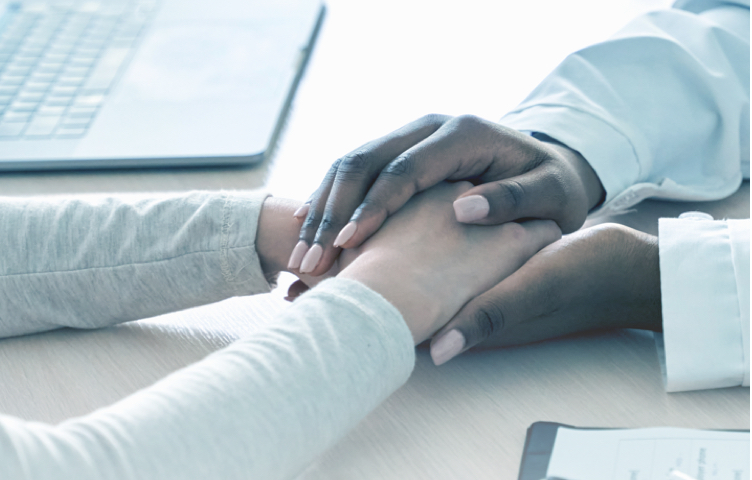 Healthcare professional reassuring patient